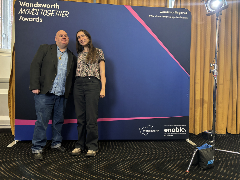 Student Daniel and Sports Tutor Hannah stand at the awards ceremony to have their photo taken