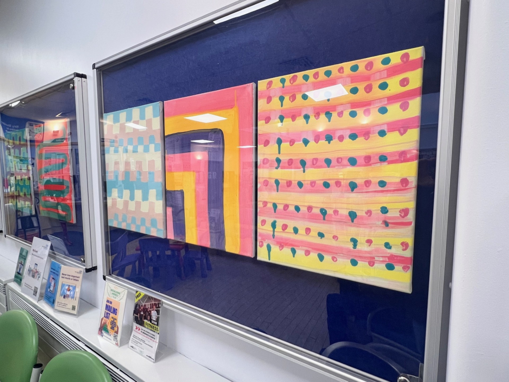 A display of artwork on a health centre wall