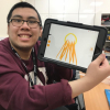 Vincent drawing dreamcatcher designs on the iPad