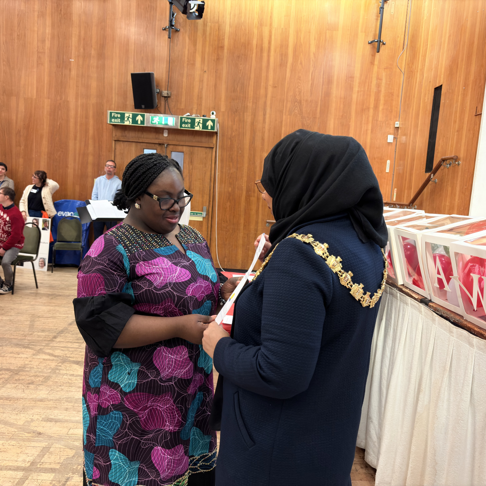 Student receiving a certificate from the mayor