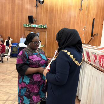 Student receiving a certificate from the mayor